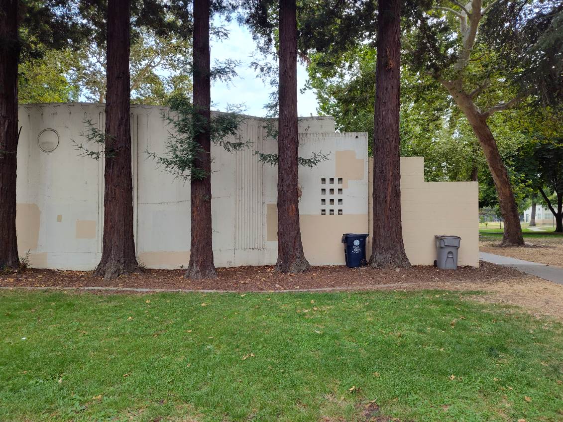 Back, right side of the amphitheater where the new mural will go.